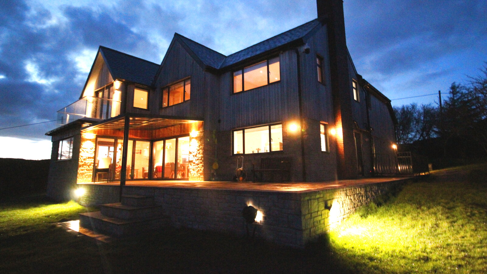 Tyne View House Northumberland at night — contemporary cedar-clad home overlooking the Tyne valley