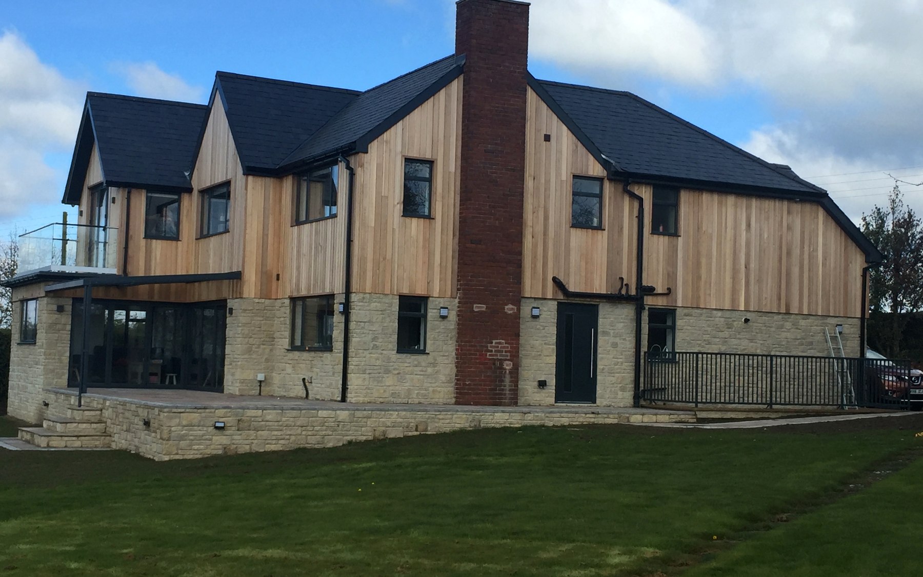 Cedar-clad rear elevation of contemporary Northumberland family home — The Beeches, Tyne valley