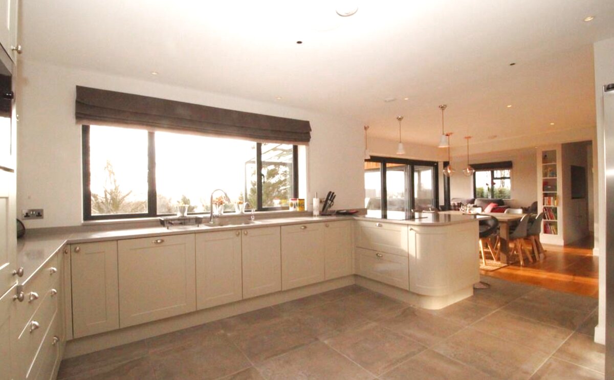Contemporary kitchen with valley views — Tyne View House, Northumberland family home