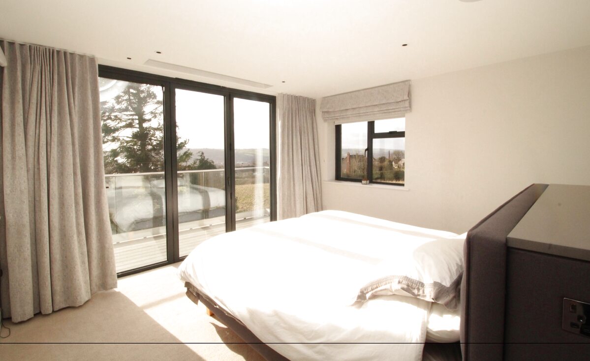 Master bedroom with terrace doors and Tyne valley outlook — Tyne View House, Northumberland