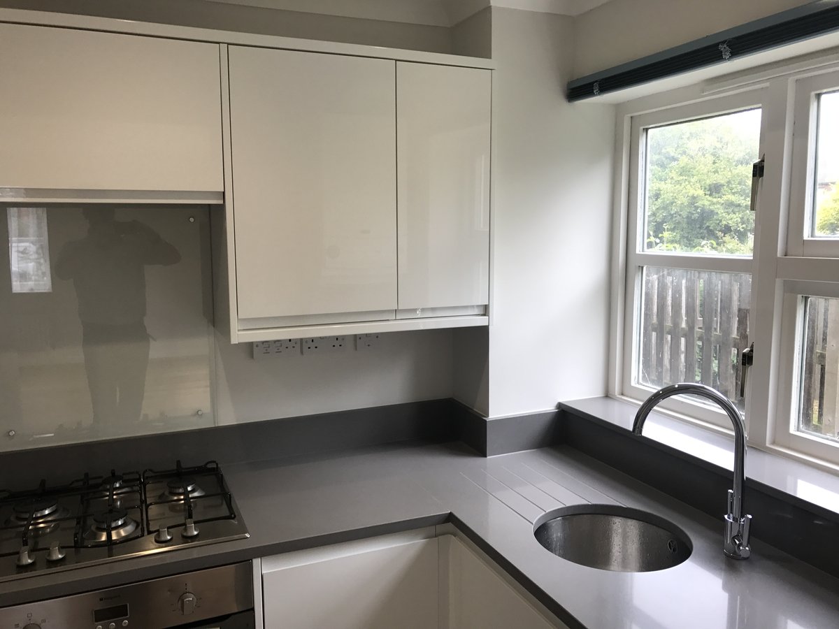 Modern fitted kitchen with Smeg gas hob — Weyview Court apartment refurbishment, Guildford