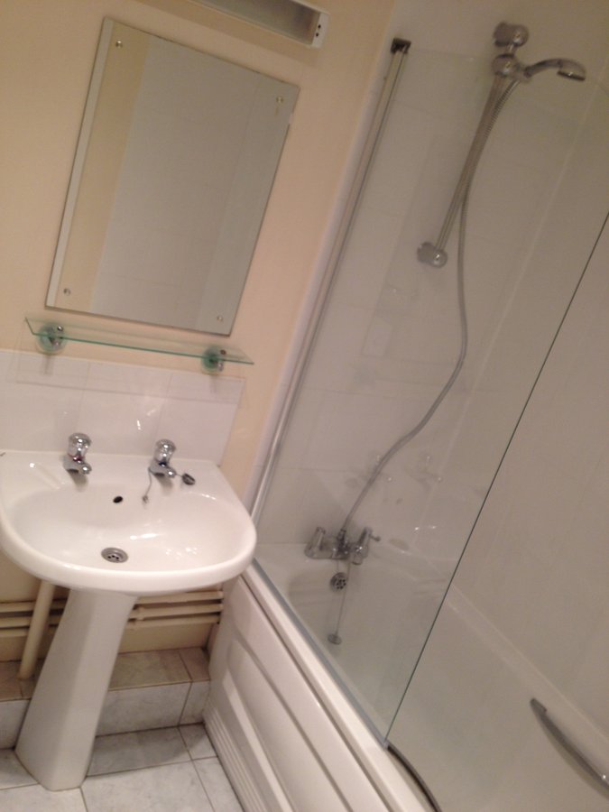 Before flood remediation — original bathroom, Weyview Court Guildford apartment