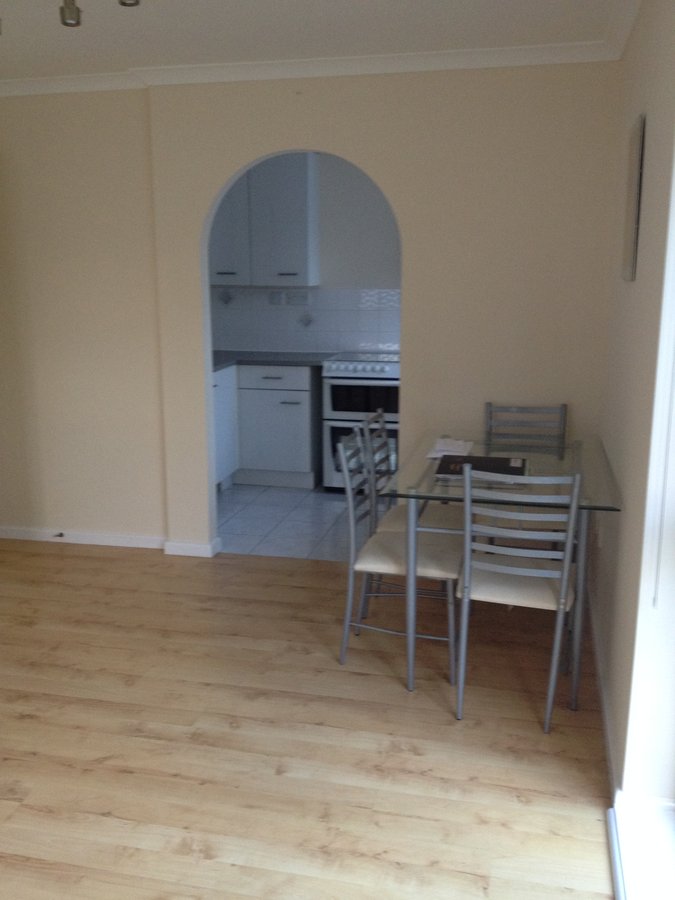 Before flood remediation — original living room with arch, Weyview Court Guildford