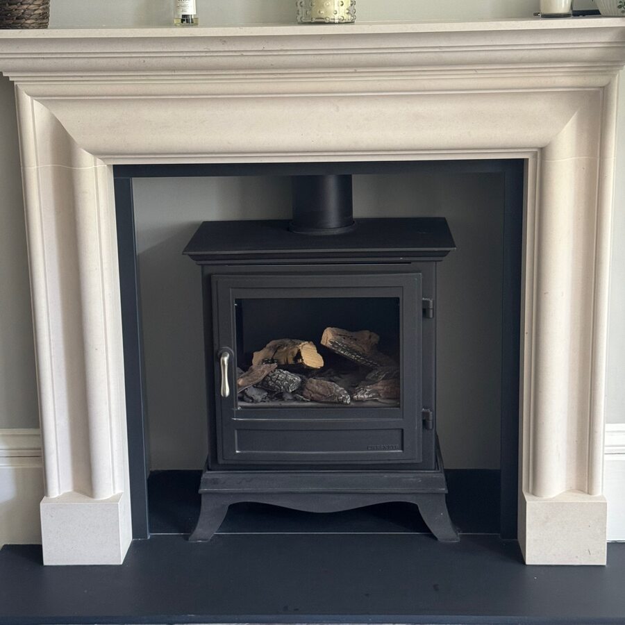 Restored period fireplace with wood-burning stove — Grade I Georgian apartment, Newcastle