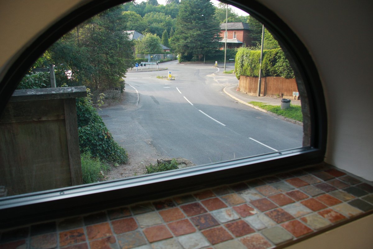 Original stone arch window retained in commercial conversion — The Old Forge Godalming