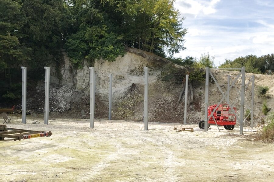 Steel columns set against quarry wall during foundation works — Quarry Works, Surrey