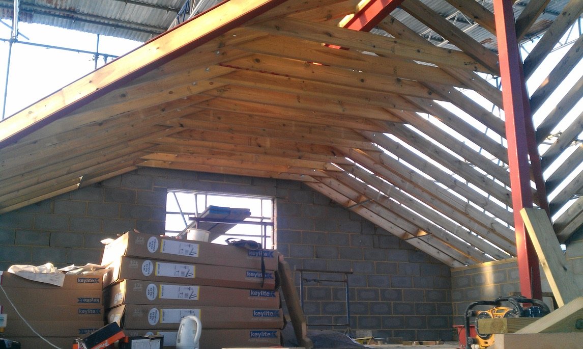 New timber roof structure during whole-house transformation — The Mount, Guildford