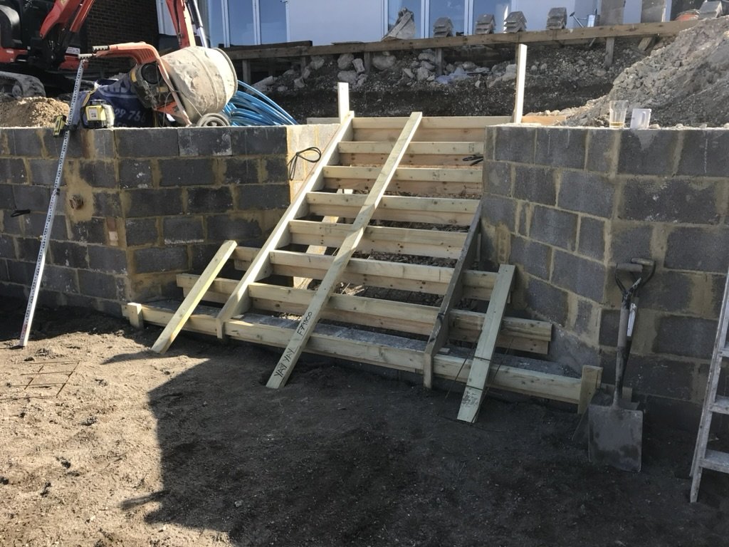 Construction stage timber stairs and blockwork extension — The Mount, Guildford