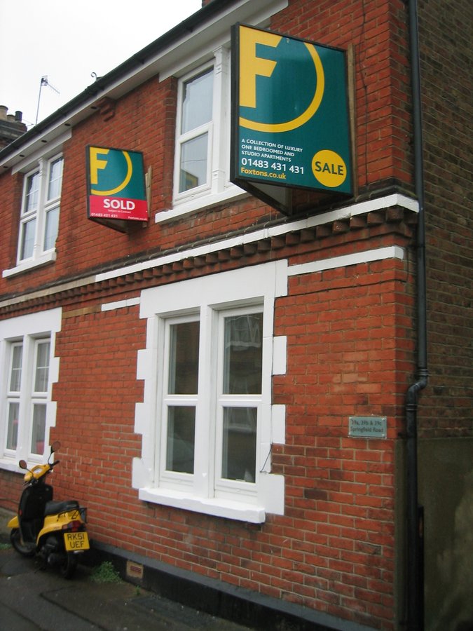 Foxtons SOLD sign on facade after off-plan sale — Springfield Road Victorian-to-flats conversion, Guildford