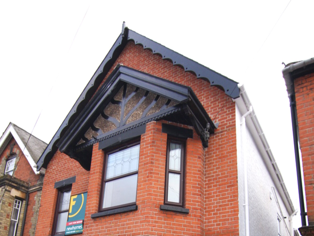 Detached Victorian townhouse facade with restored gable detail — Surrey conversion to apartments