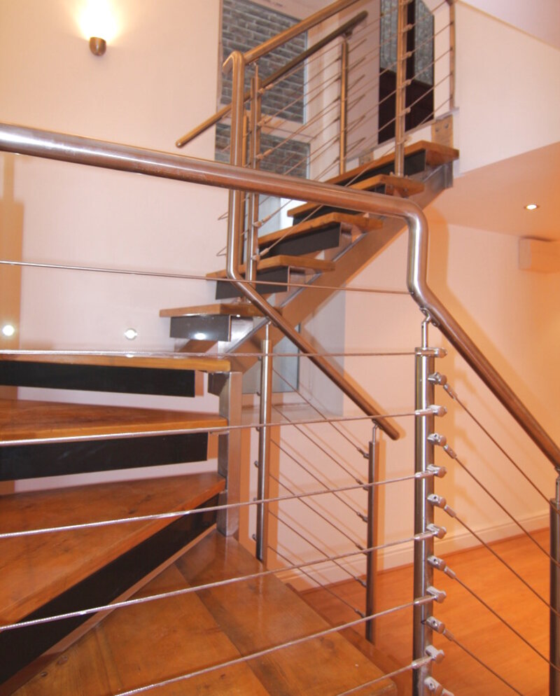 Bespoke open-riser staircase with cable balustrade — Victorian townhouse conversion, Surrey