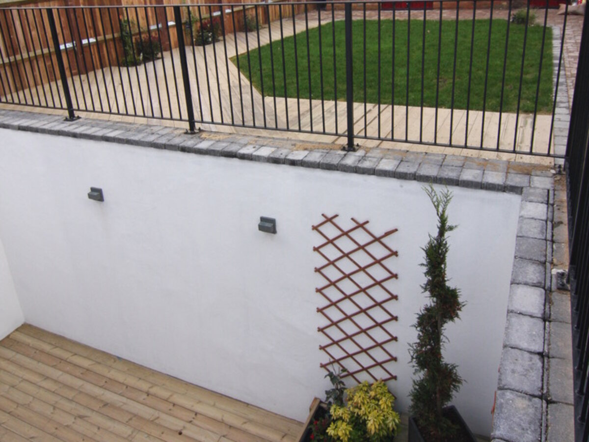 Rear garden and lower-ground deck — Victorian townhouse conversion to apartments, Surrey