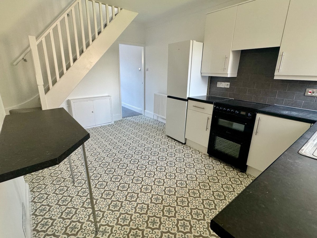 Modern kitchen with patterned encaustic tiles — Surrey Victorian terrace renovation