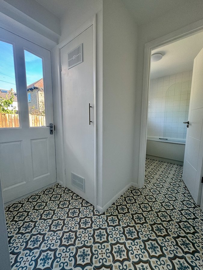 Entrance hall with restored patterned tile flooring — Victorian terrace renovation, Surrey